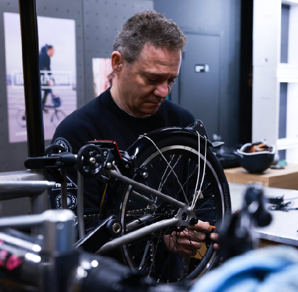 Mechanic fixing a Brompton