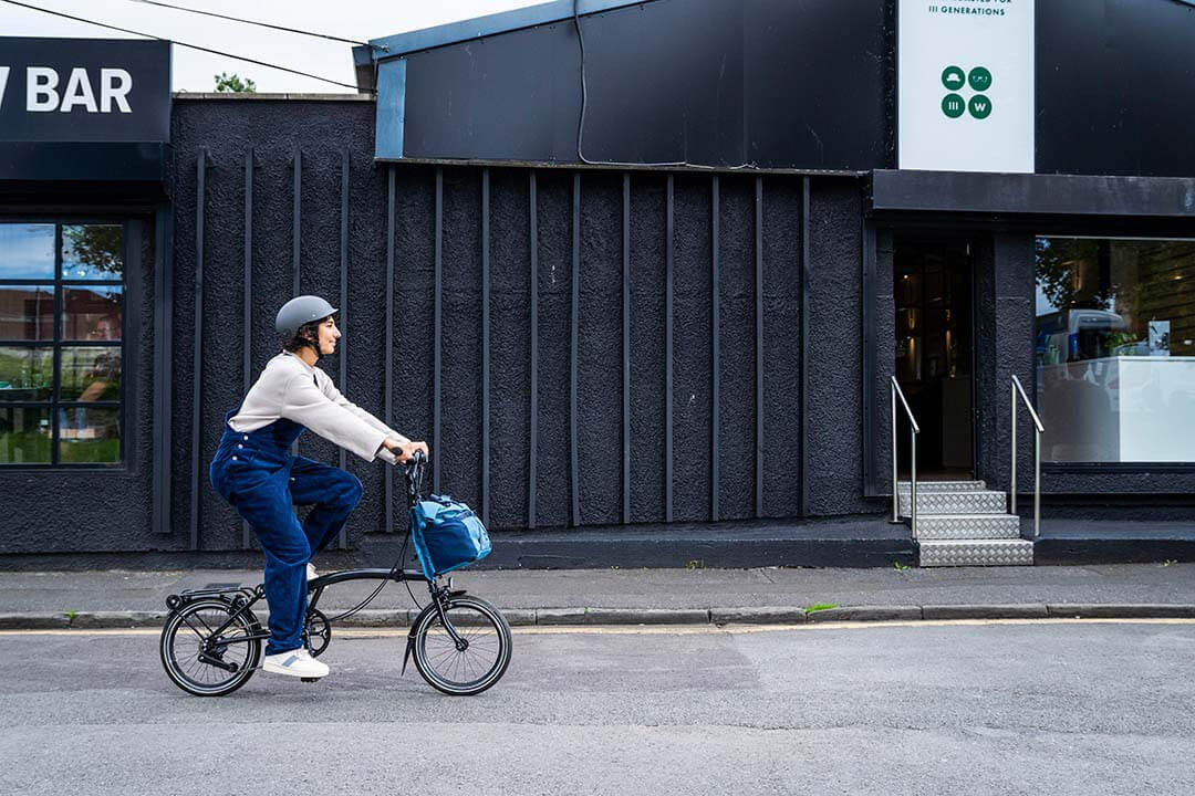 Woman riding Brompton Bike